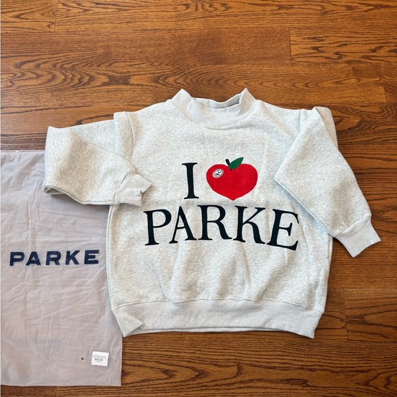 Stylish White Sweatshirt with Red Apple Graphic - Picture 2 of 4